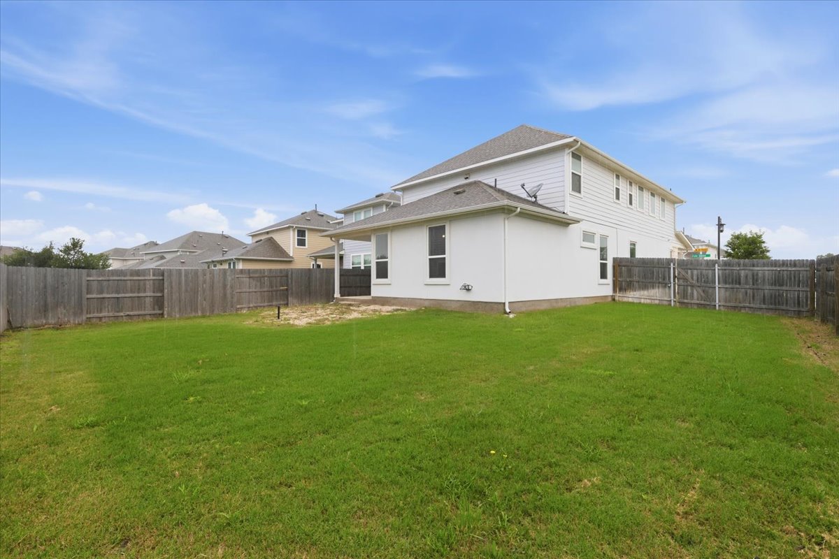101 Free Stone Drive Georgetown, TX 78628 - Photo 36 of 40 Expansive grassy yard with full privacy fencing