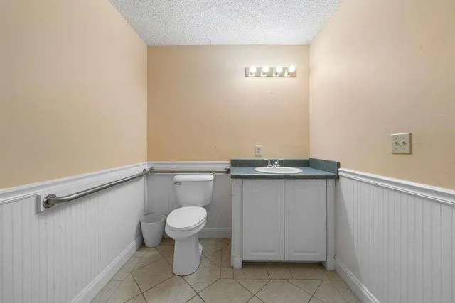 a bathroom with a toilet and a sink