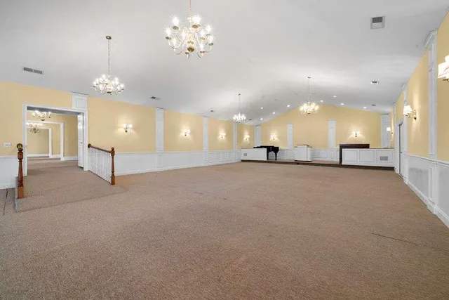 a view of a balcony with wooden fence