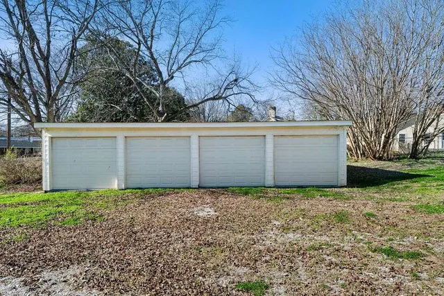 a kitchen with refrigerator and cabinets