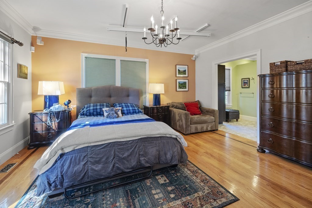 3 Benjamin Road Lexington, MA 02421 - Photo 12 of 42 a spacious bedroom with a bed and wooden floor