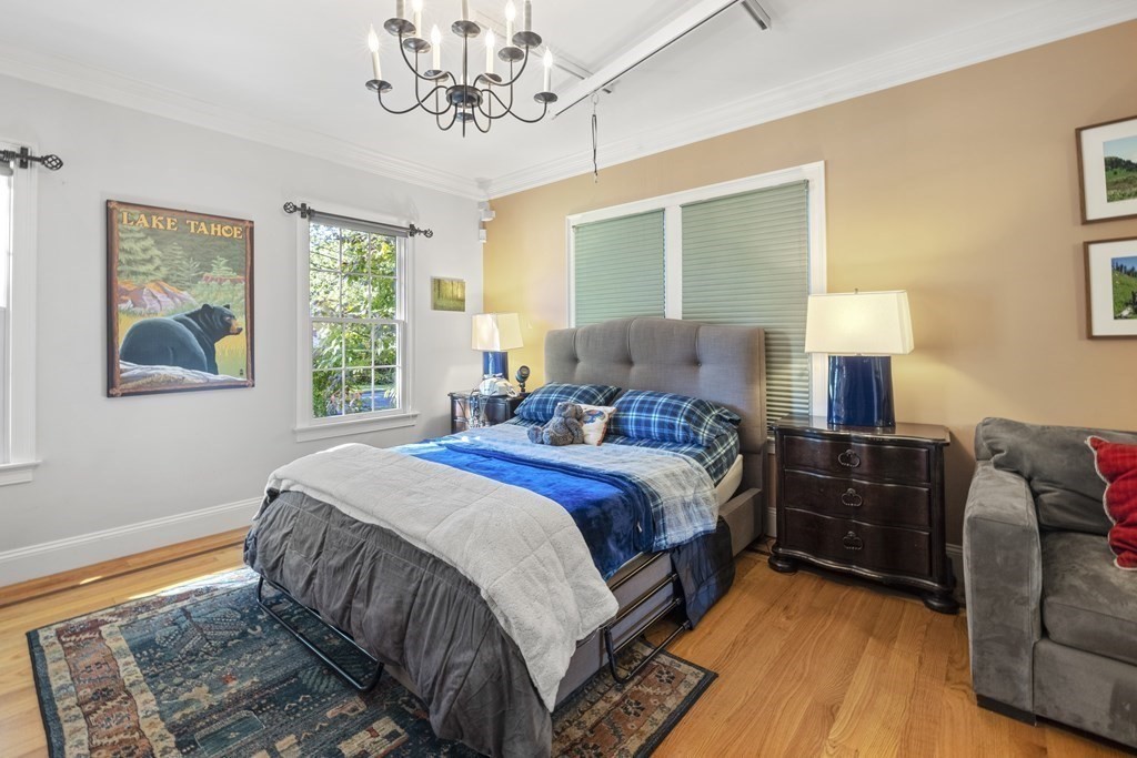 3 Benjamin Road Lexington, MA 02421 - Photo 13 of 42 a bedroom with a bed and wooden floor