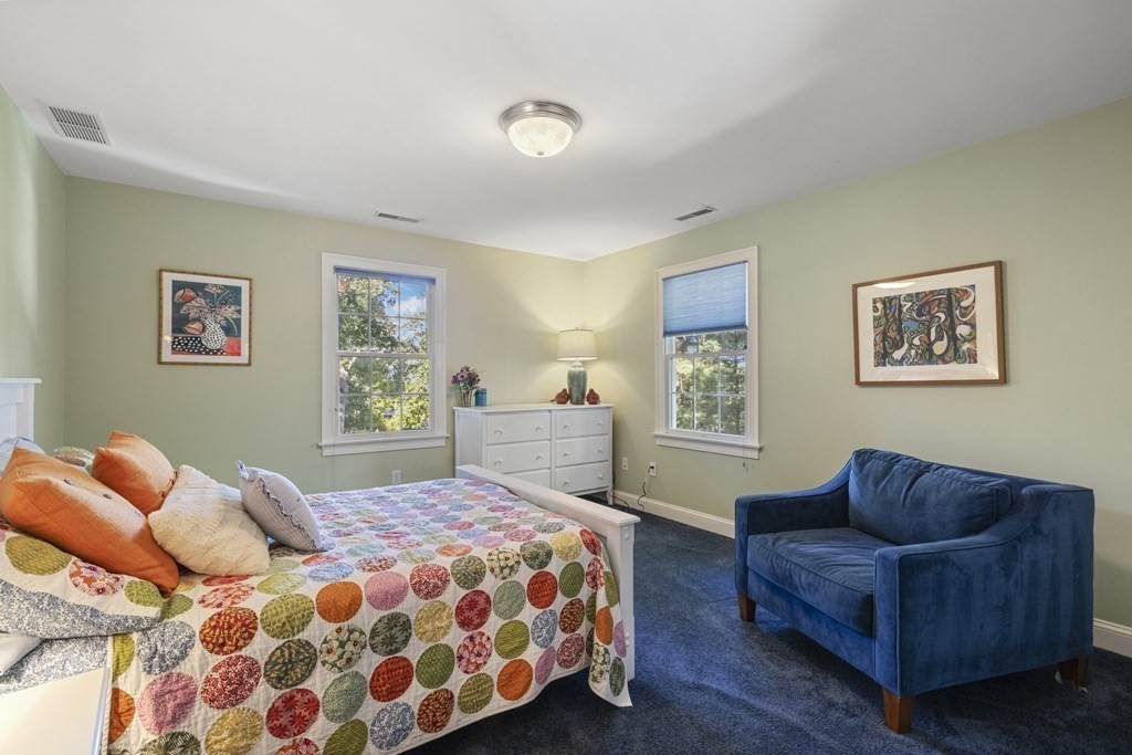 3 Benjamin Road Lexington, MA 02421 - Photo 19 of 42 a bedroom with a bed two couch and a window