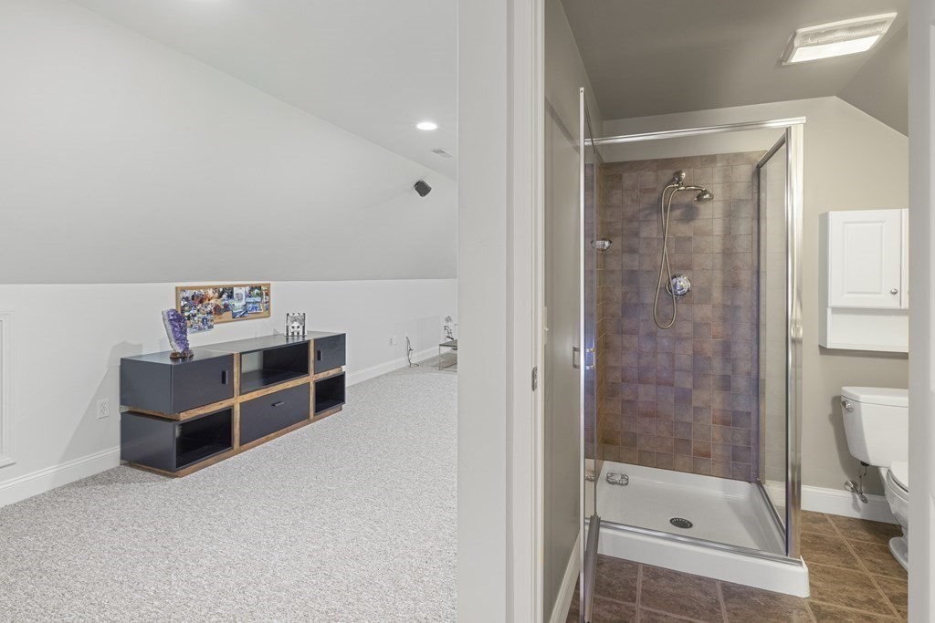3 Benjamin Road Lexington, MA 02421 - Photo 24 of 42 a room with a walk in closet and shower