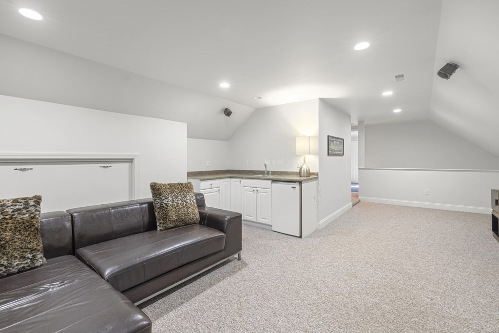 3 Benjamin Road Lexington, MA 02421 - Photo 26 of 42 a living room with furniture and kitchen view