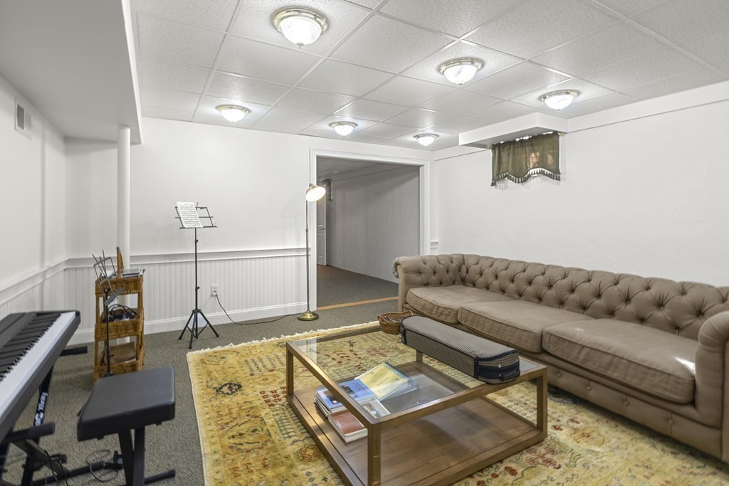 3 Benjamin Road Lexington, MA 02421 - Photo 30 of 42 a living room with furniture and a rug