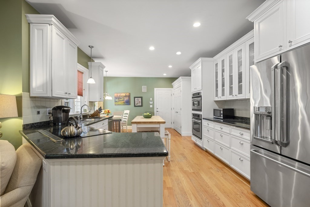 3 Benjamin Road Lexington, MA 02421 - Photo 3 of 42 a kitchen with stainless steel appliances granite countertop a sink refrigerator and cabinets