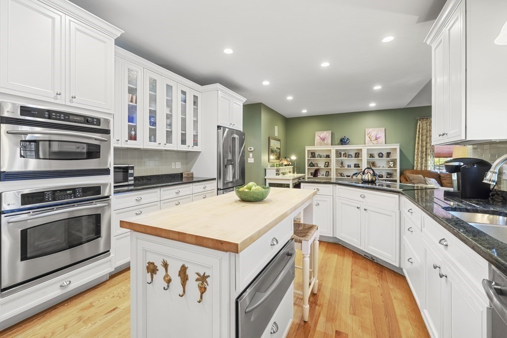 3 Benjamin Road Lexington, MA 02421 - Photo 4 of 42 a kitchen with kitchen island a stove sink and microwave