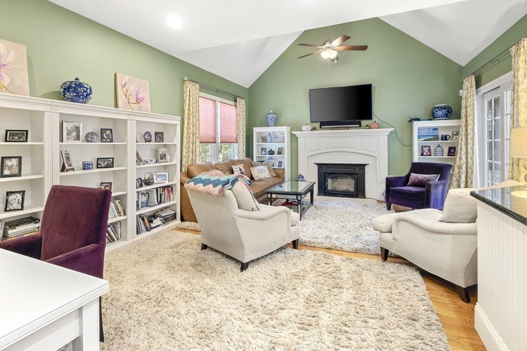 3 Benjamin Road Lexington, MA 02421 - Photo 7 of 42 a living room with furniture and a fireplace