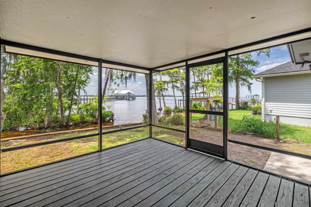 a view of a large window with wooden floor