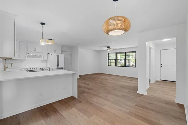 a view of kitchen with sink and window
