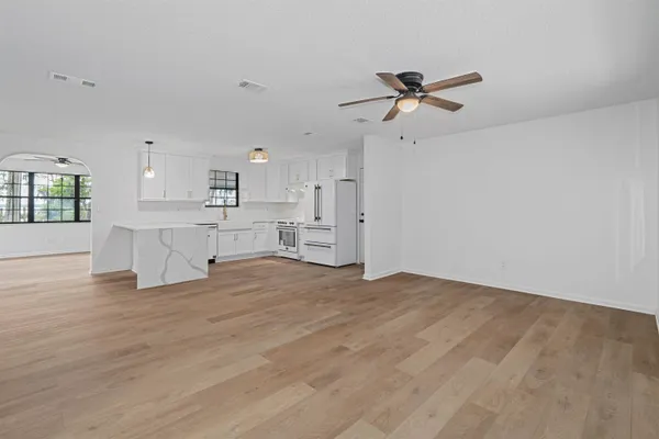 a view of a kitchen with a sink and cabinets
