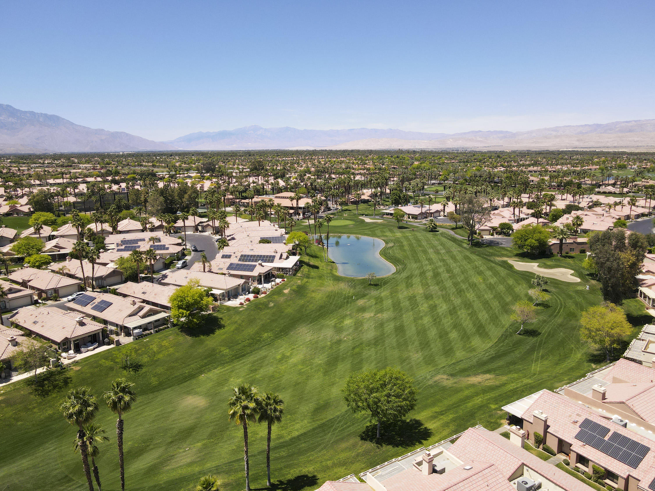 42641 Liolios Drive Palm Desert, CA 92211 - Photo 1 of 44 an aerial view of residential houses with outdoor space