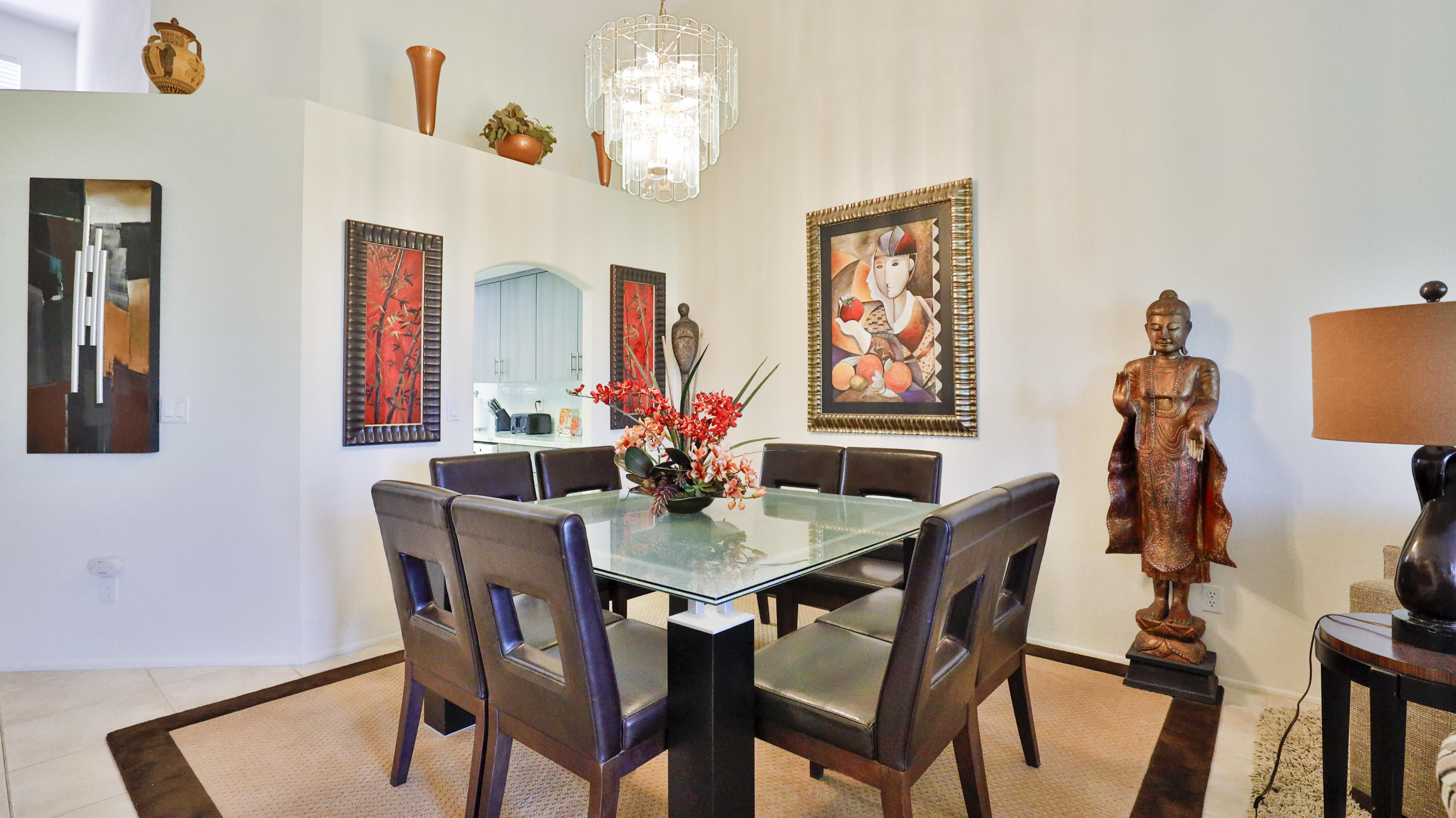 42641 Liolios Drive Palm Desert, CA 92211 - Photo 11 of 44 a view of a dining room with furniture and chandelier