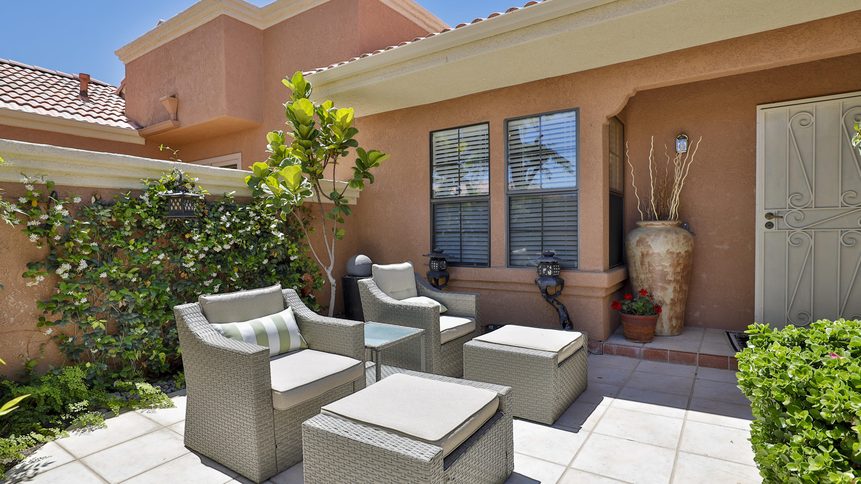 42641 Liolios Drive Palm Desert, CA 92211 - Photo 4 of 44 a view of a patio with couple of chairs and potted plants