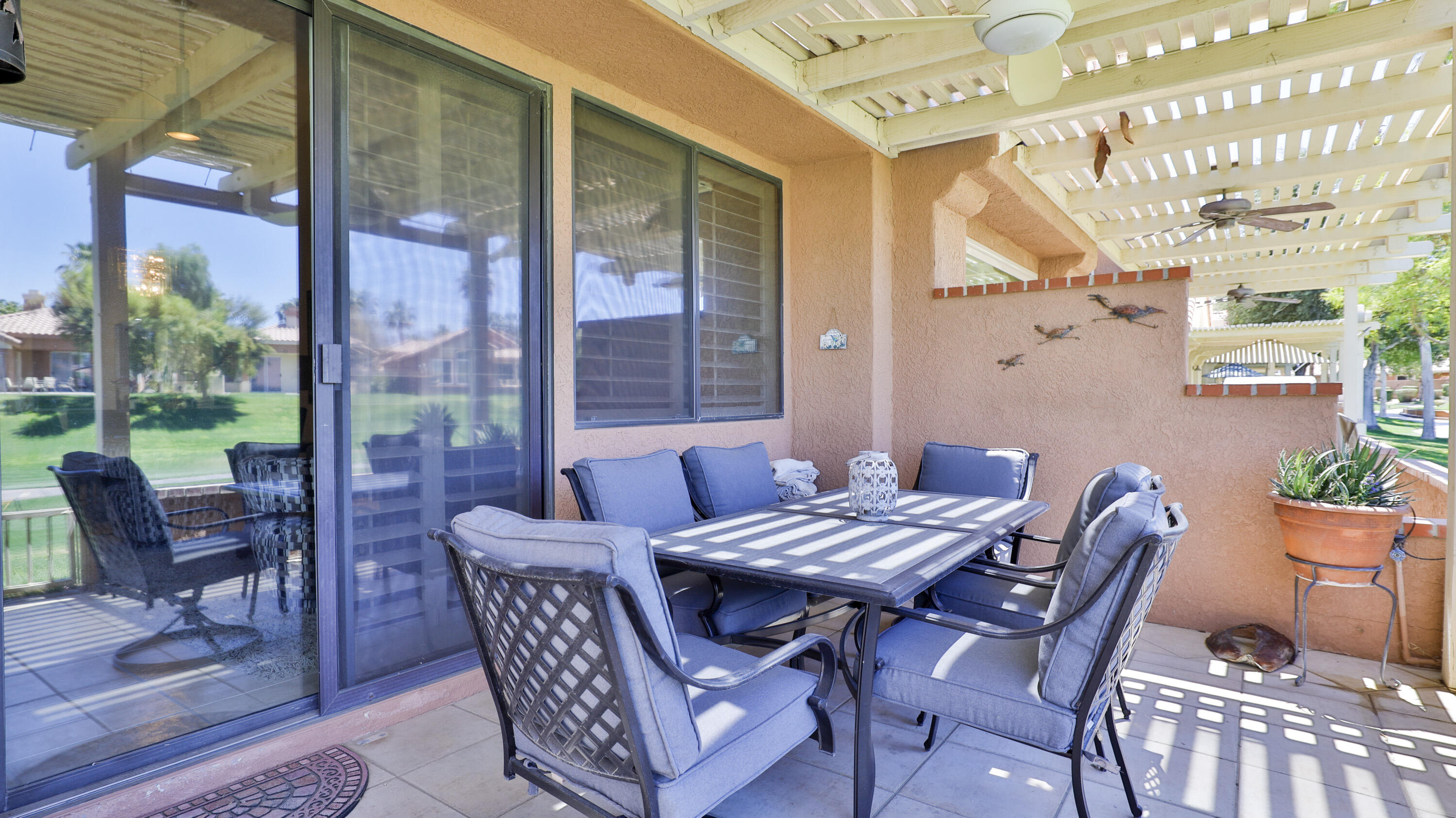 42641 Liolios Drive Palm Desert, CA 92211 - Photo 34 of 44 a view of a patio with a table and chairs