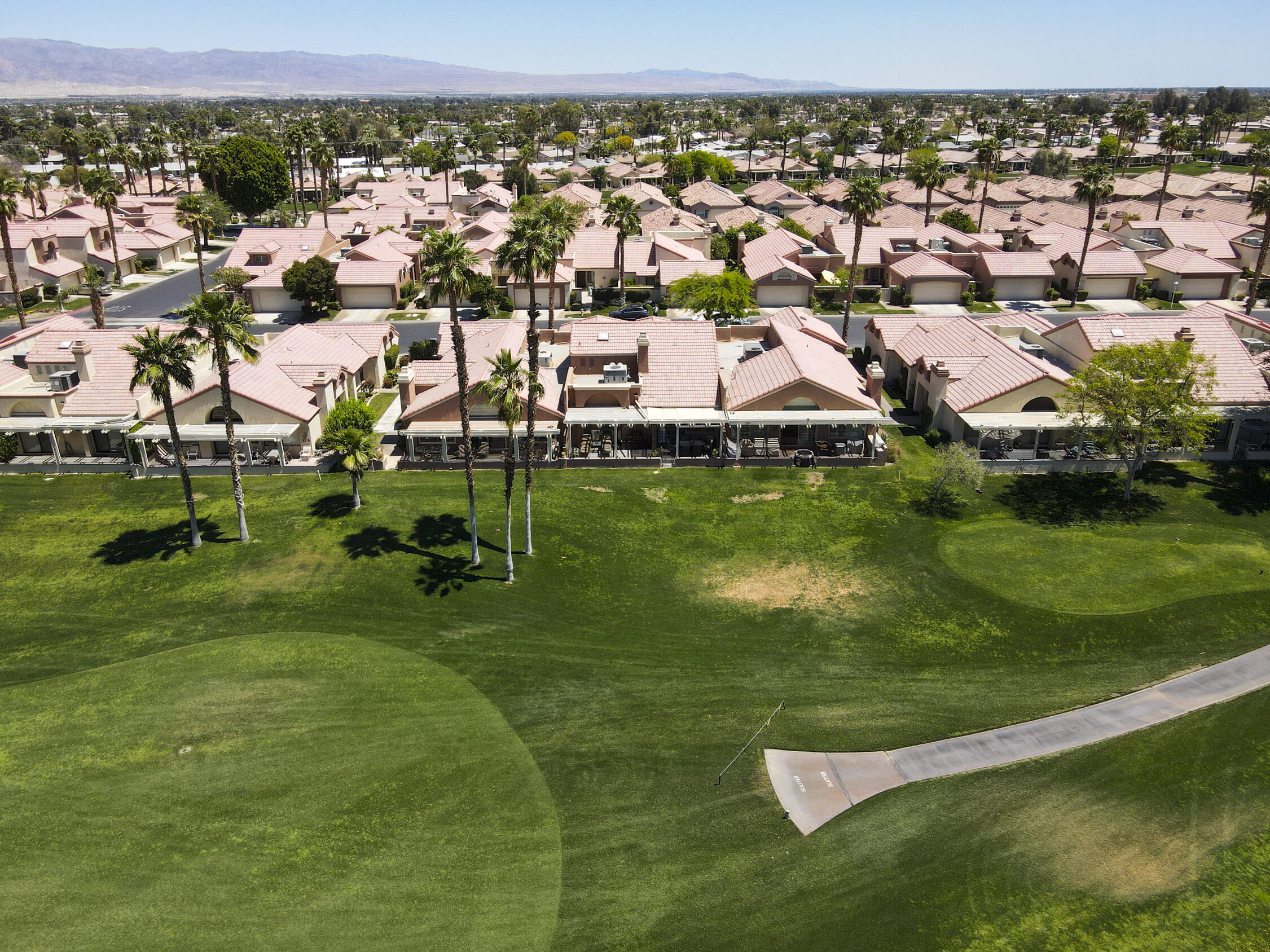 42641 Liolios Drive Palm Desert, CA 92211 - Photo 38 of 44 an aerial view of residential houses with outdoor space and trees