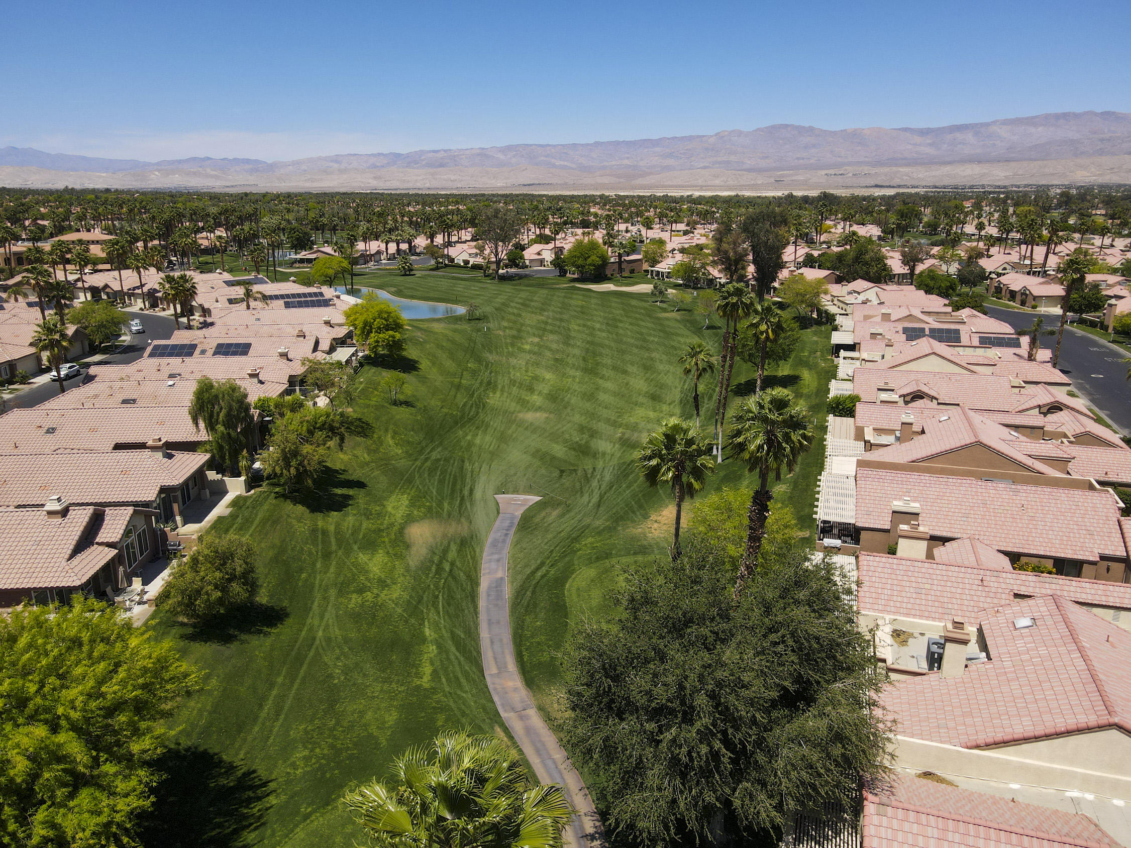 42641 Liolios Drive Palm Desert, CA 92211 - Photo 39 of 44 an aerial view of residential houses with outdoor space