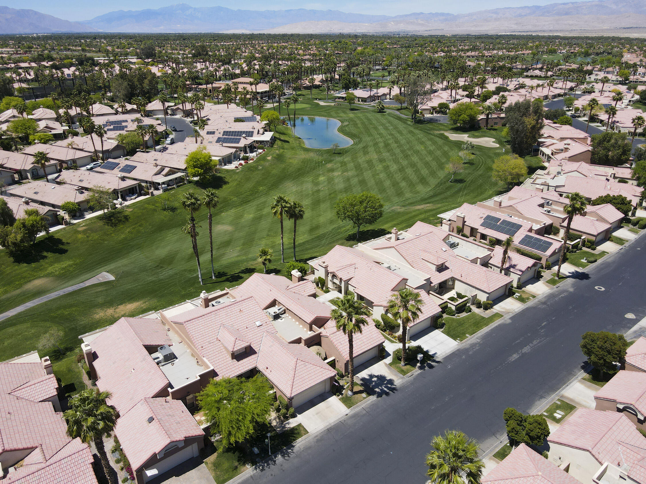 42641 Liolios Drive Palm Desert, CA 92211 - Photo 42 of 44 an aerial view of residential houses with outdoor space