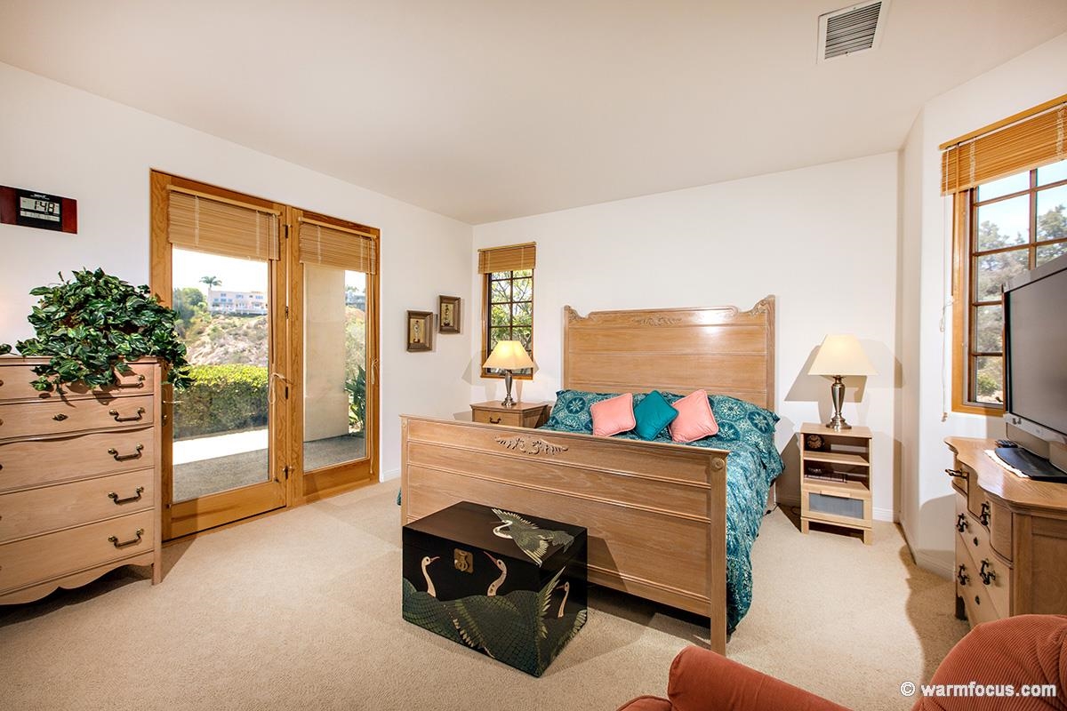 4610 Rancho Reposo Del Mar, CA 92014 - Photo 14 of 25 Spacious downstairs bedroom has a private balcony, attached bath area and a separate door to the pool.