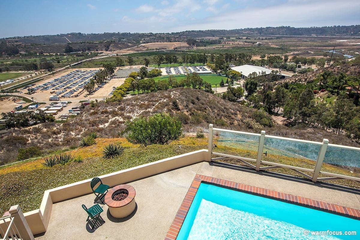 4610 Rancho Reposo Del Mar, CA 92014 - Photo 18 of 25 The firepit in the pool area provides a warm place to hang out in between lazy swim time.