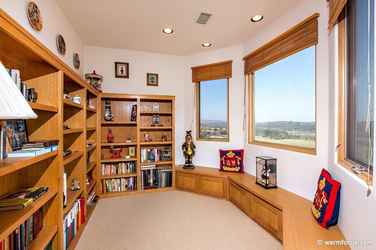 4610 Rancho Reposo Del Mar, CA 92014 - Photo 20 of 25 Built-in shelves and beautiful view windows line this extra sitting room in the master bedroom.