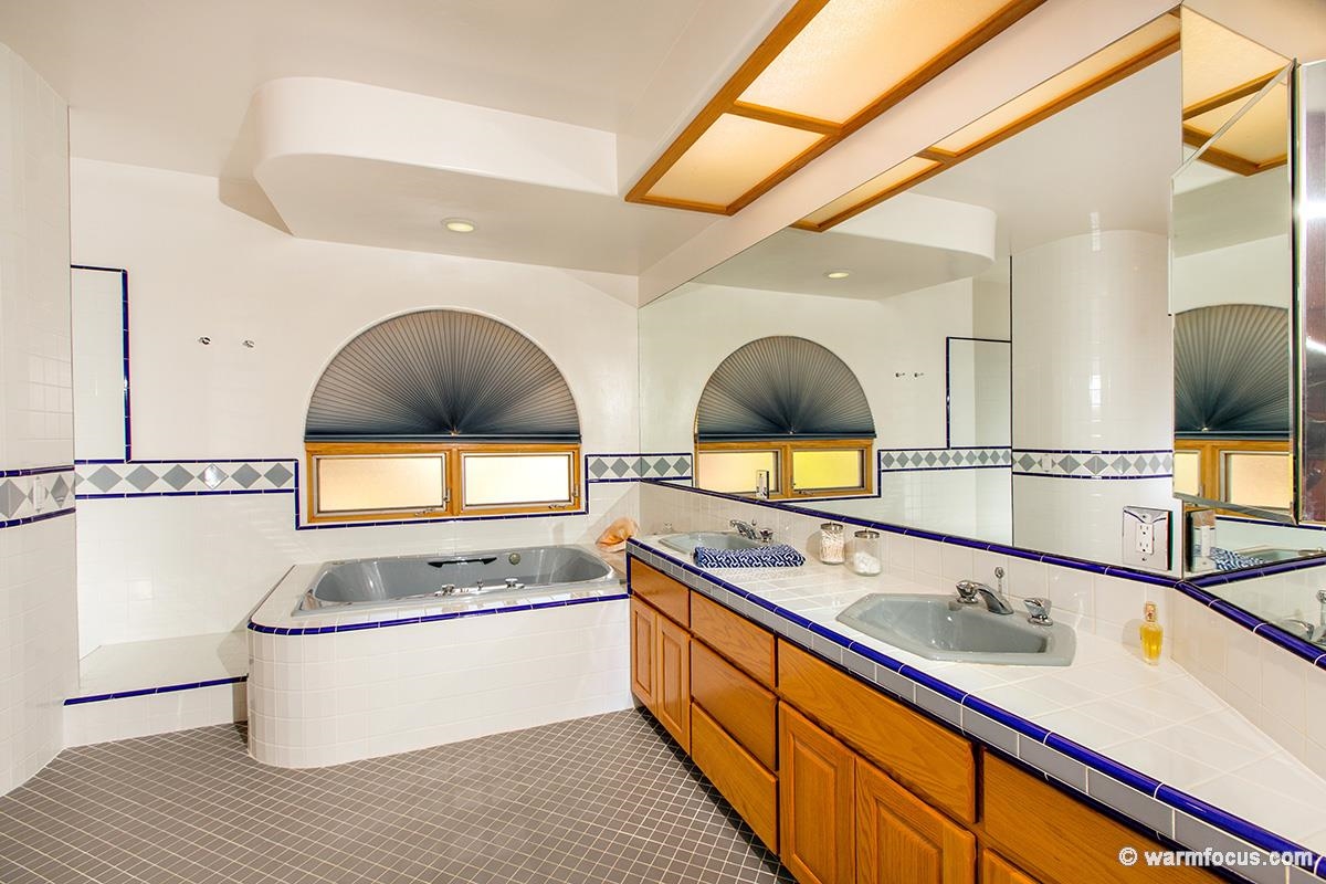 4610 Rancho Reposo Del Mar, CA 92014 - Photo 21 of 25 Dual sinks, spacious tub, and deep shower area which doesn't require a door highlight the master bath.