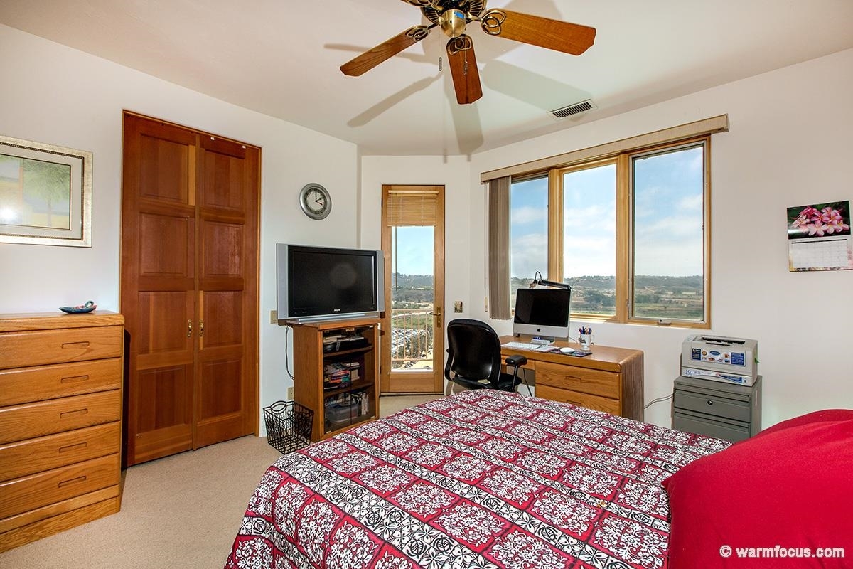 4610 Rancho Reposo Del Mar, CA 92014 - Photo 22 of 25 This bedroom also has a private balcony and a spacious walk in closet.