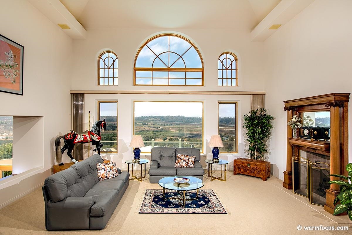 4610 Rancho Reposo Del Mar, CA 92014 - Photo 5 of 25 Living room is accentuated with a fireplace and antique Empire surround.