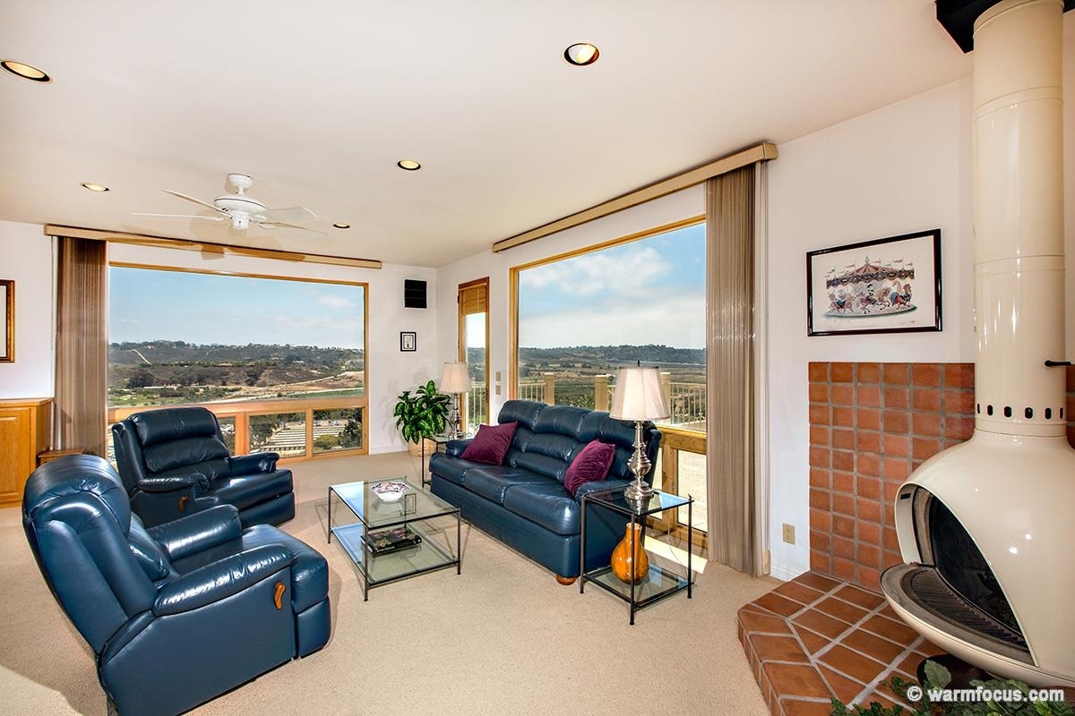 4610 Rancho Reposo Del Mar, CA 92014 - Photo 7 of 25 Fireplace in family room with pool access.