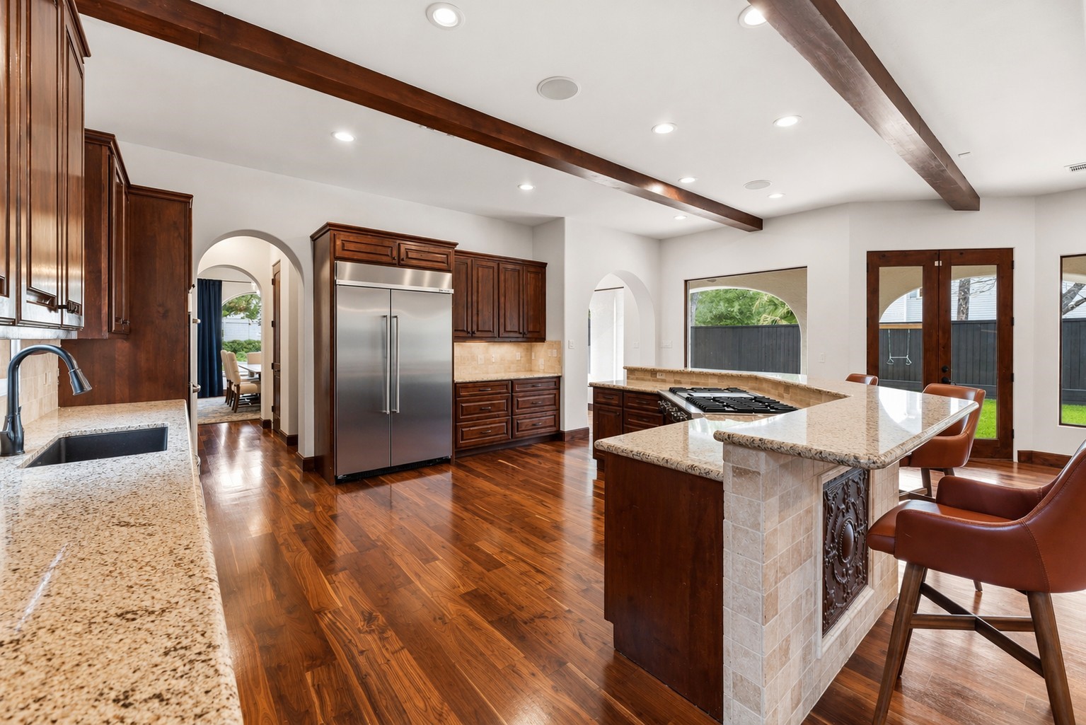 3803 Drake Street Houston, TX 77005 - Photo 11 of 32 a view of a kitchen with stainless steel appliances granite countertop a stove and a refrigerator