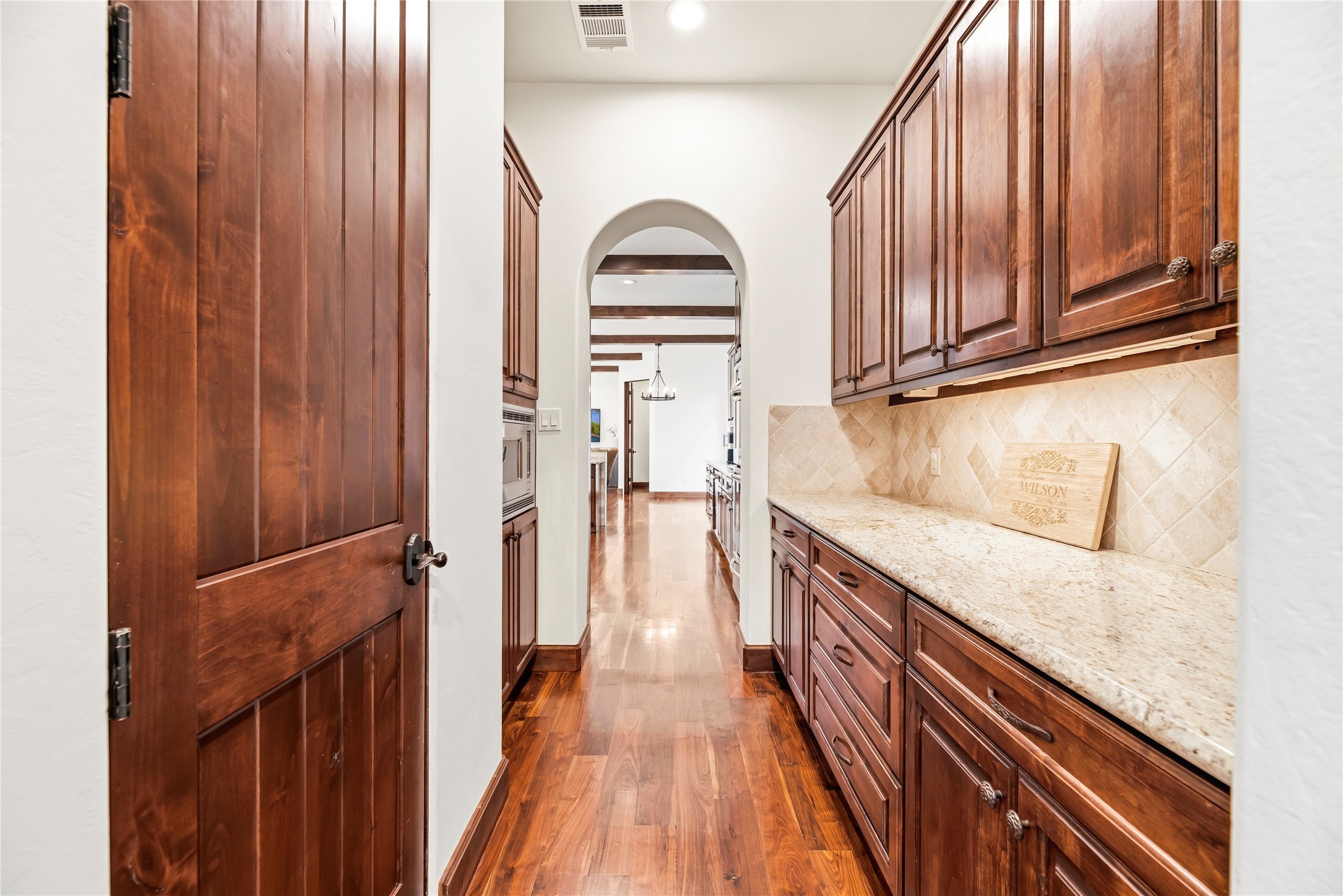 3803 Drake Street Houston, TX 77005 - Photo 13 of 32 a view of a kitchen with wooden floor and staircase