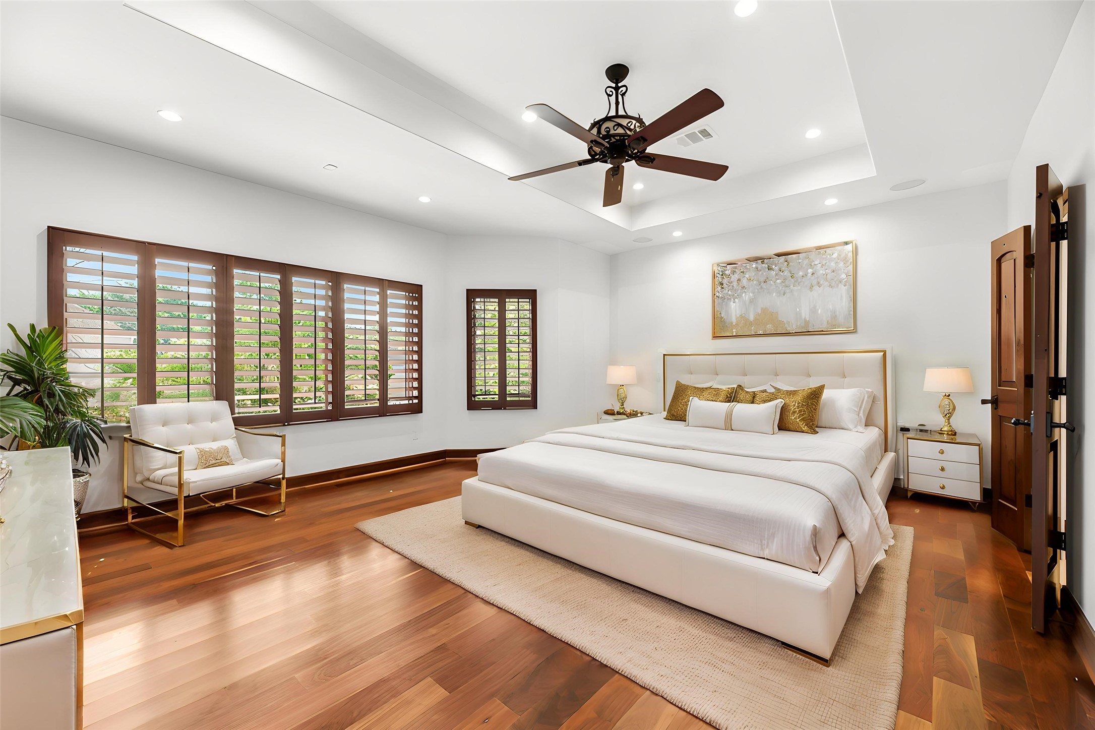 3803 Drake Street Houston, TX 77005 - Photo 16 of 32 a spacious bedroom with a large bed and a chandelier