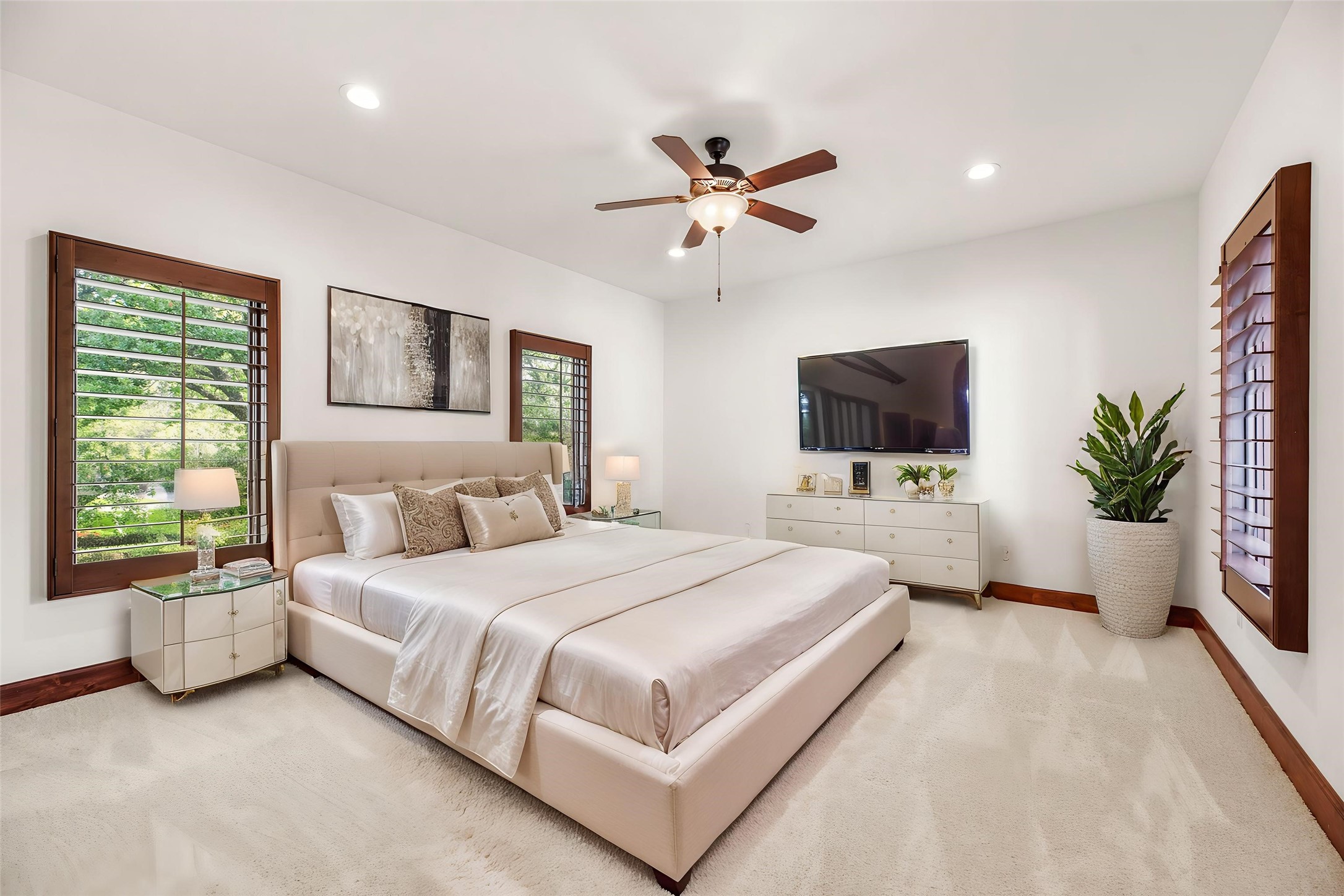 3803 Drake Street Houston, TX 77005 - Photo 22 of 32 a bedroom with a large bed and a flat screen tv