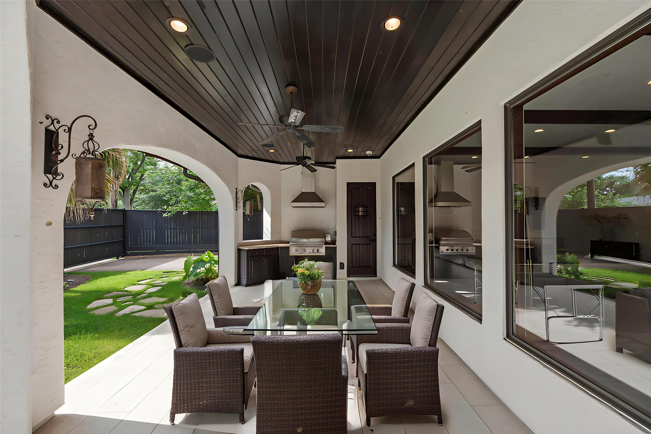 3803 Drake Street Houston, TX 77005 - Photo 29 of 32 a view of an outdoor dining space with a table and chairs
