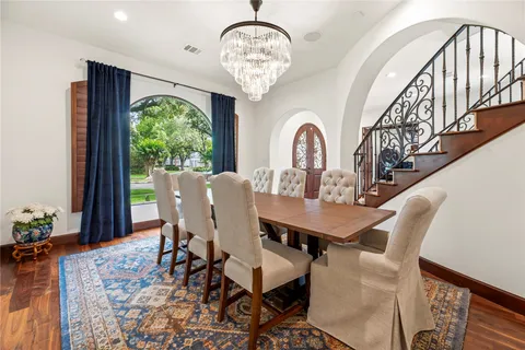 a view of a kitchen with stainless steel appliances granite countertop a stove and a refrigerator