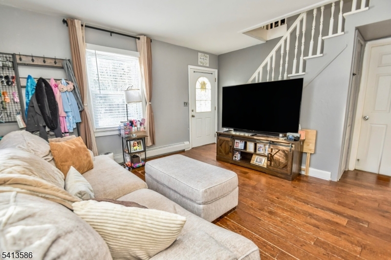 406 Morsetown Road West Milford, NJ 07480 - Photo 4 of 17 a living room with furniture and a flat screen tv