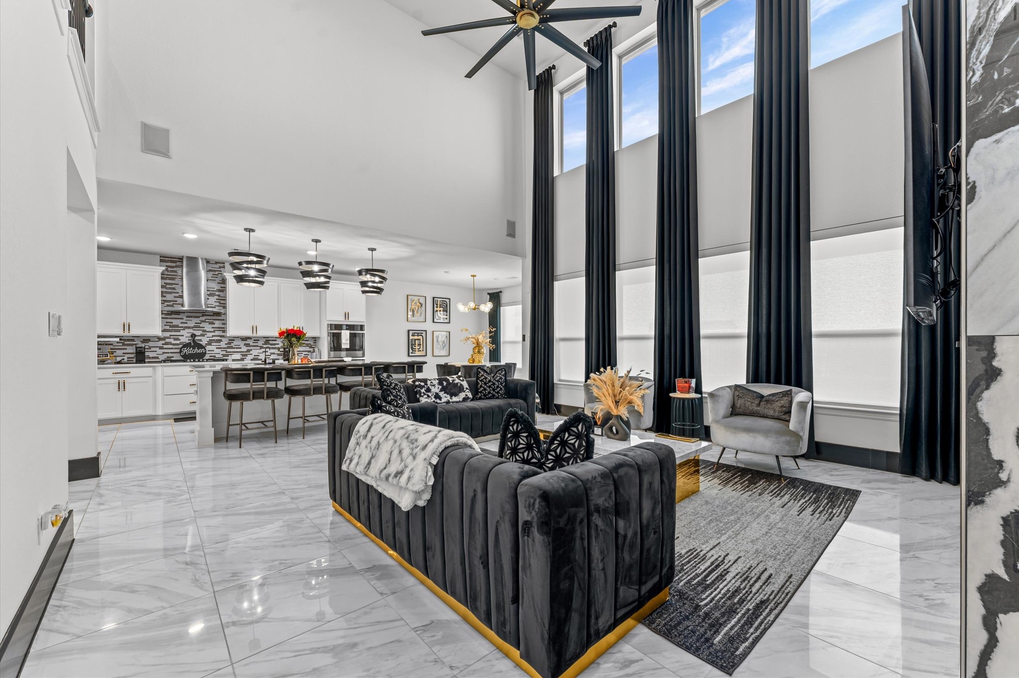 8210 Rimini Cove Court Richmond, TX 77407 - Photo 22 of 42 a living room with furniture and large windows