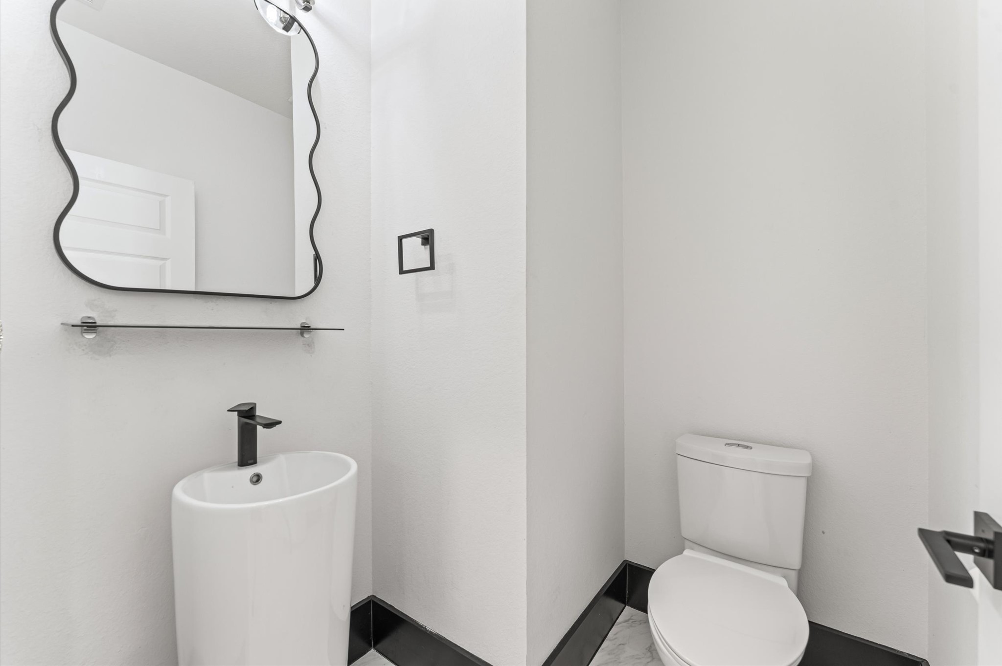 8210 Rimini Cove Court Richmond, TX 77407 - Photo 27 of 42 a bathroom with a sink mirror and toilet