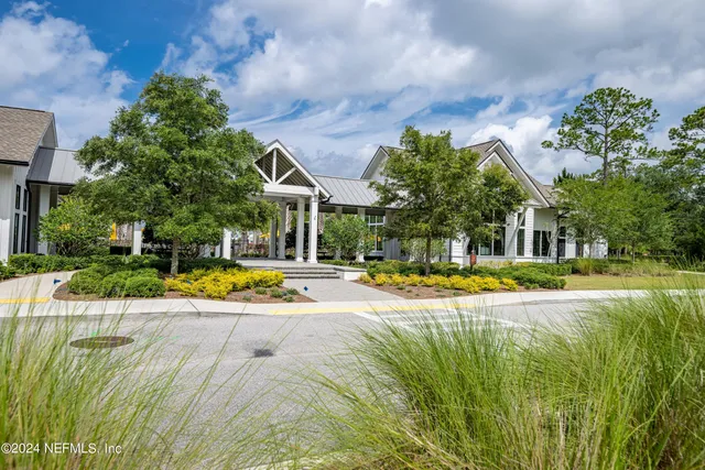 a view of swimming pool with sitting area and garden