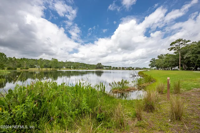 a view of lake with green space