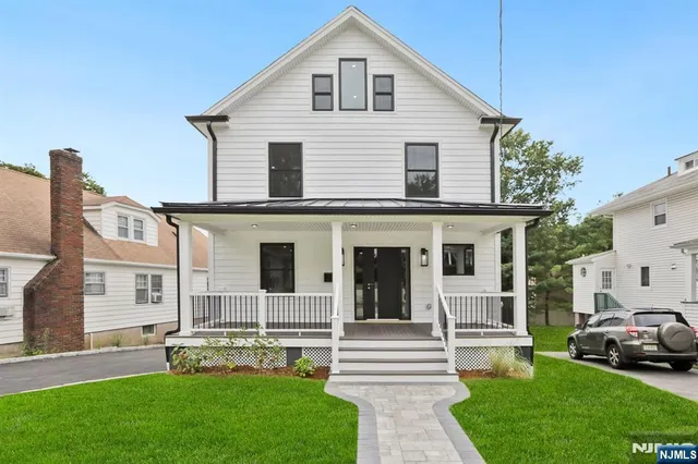 a view of house that has a yard