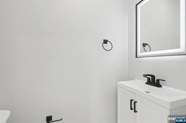 a bathroom with a sink and vanity