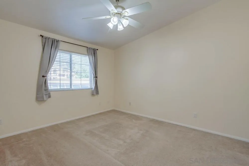 17161 Alva Road, Unit 2323 San Diego, CA 92127 - Photo 15 of 23 an empty room with a window and a fan