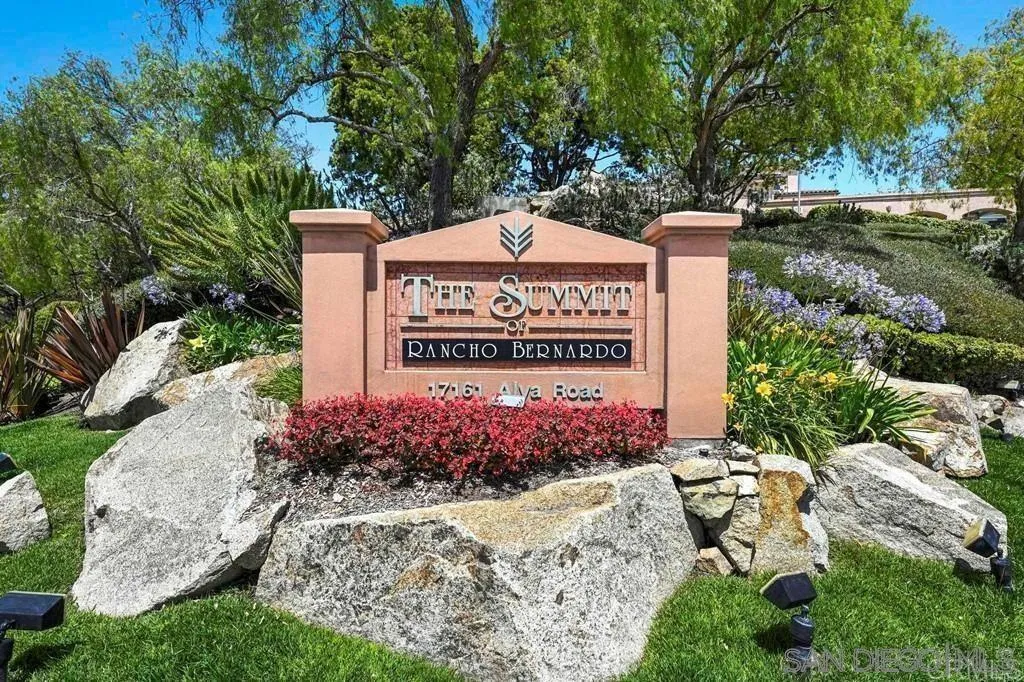 17161 Alva Road, Unit 2323 San Diego, CA 92127 - Photo 2 of 23 a sign that is sitting in front of flowers