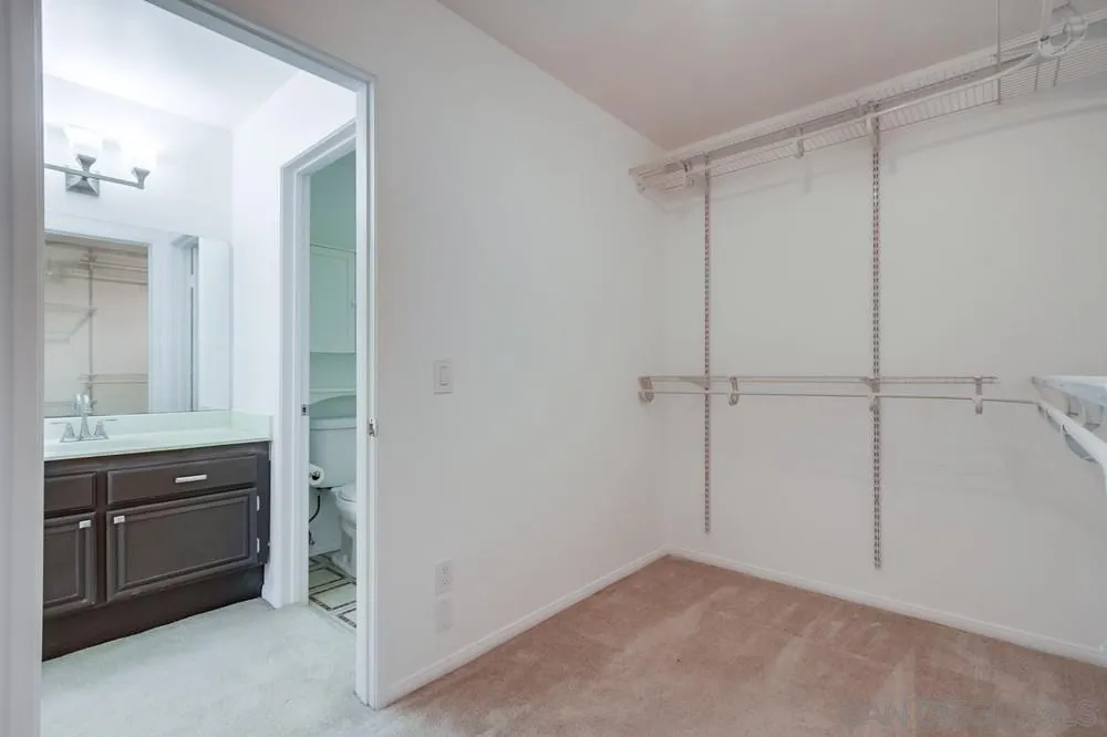 17161 Alva Road, Unit 2323 San Diego, CA 92127 - Photo 21 of 23 a view of an empty room and a kitchen