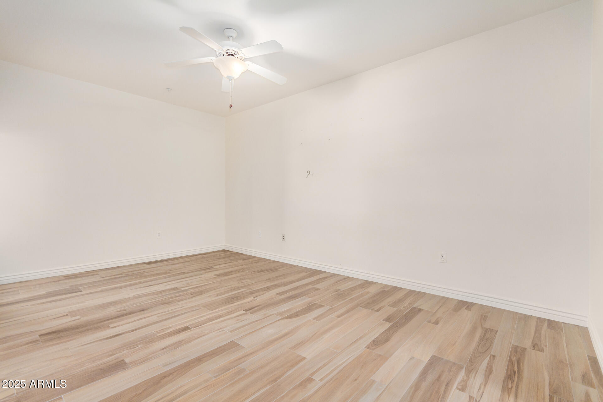 5450 East Deer Valley Drive, Unit 1211 Phoenix, AZ 85054 - Photo 18 of 26 wooden floor in a empty room