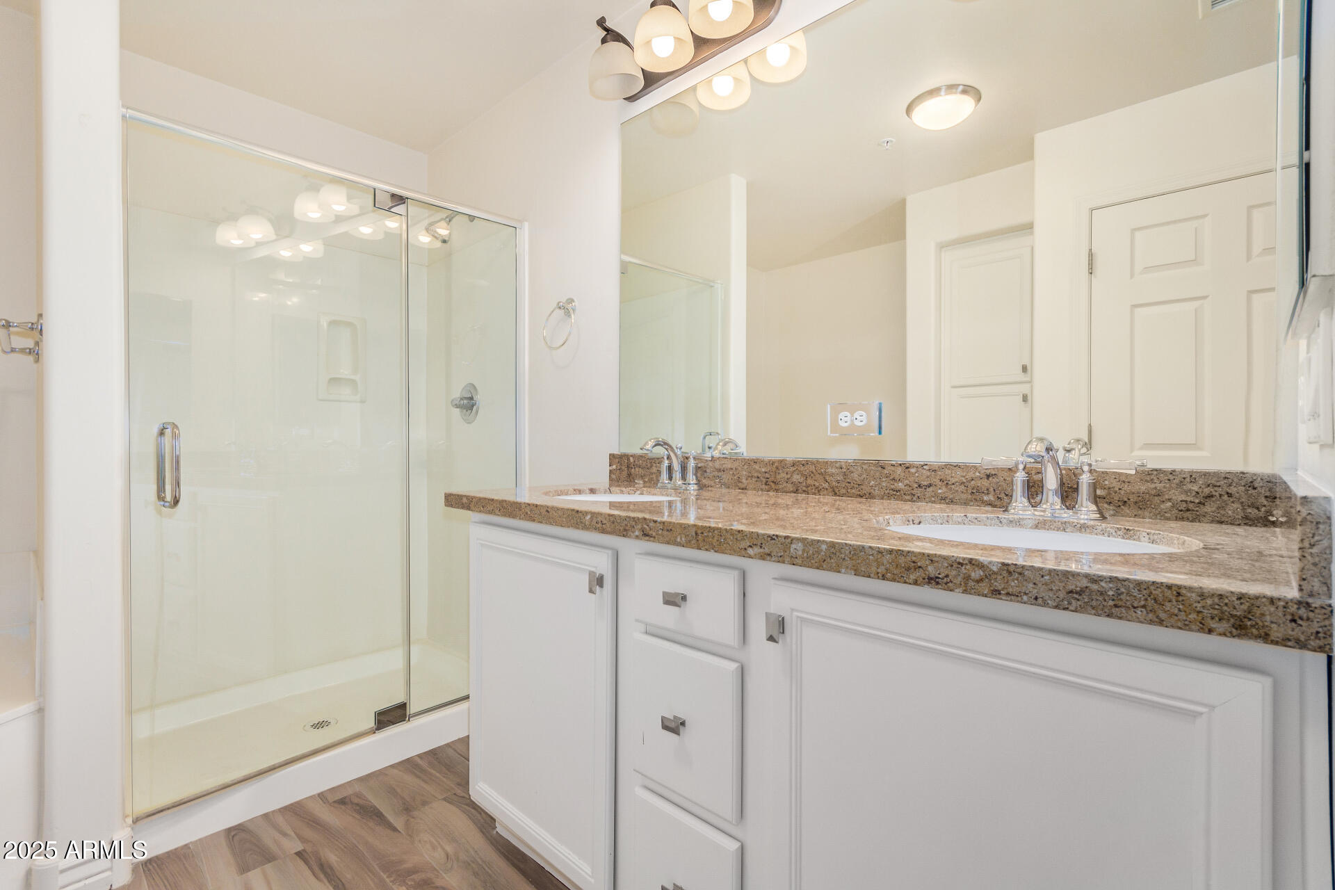 5450 East Deer Valley Drive, Unit 1211 Phoenix, AZ 85054 - Photo 21 of 26 a bathroom with a granite countertop sink mirror and double