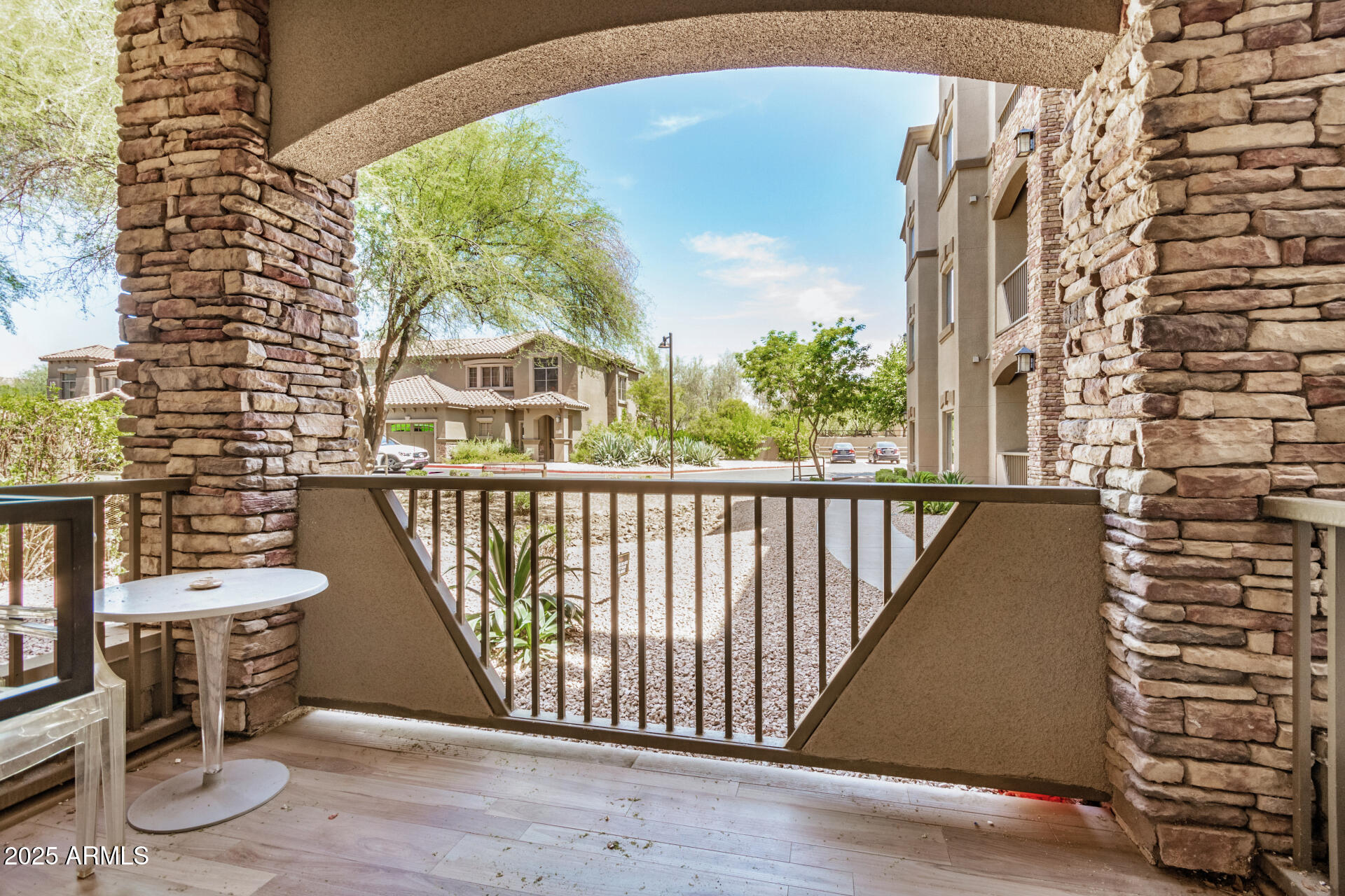 5450 East Deer Valley Drive, Unit 1211 Phoenix, AZ 85054 - Photo 10 of 26 a view of a balcony with chairs