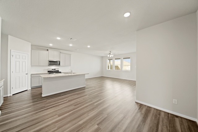 10422 Sherwin Pass Drive Rosharon, TX 77583 - Photo 12 of 26 a view of kitchen with wooden floor and electronic appliances